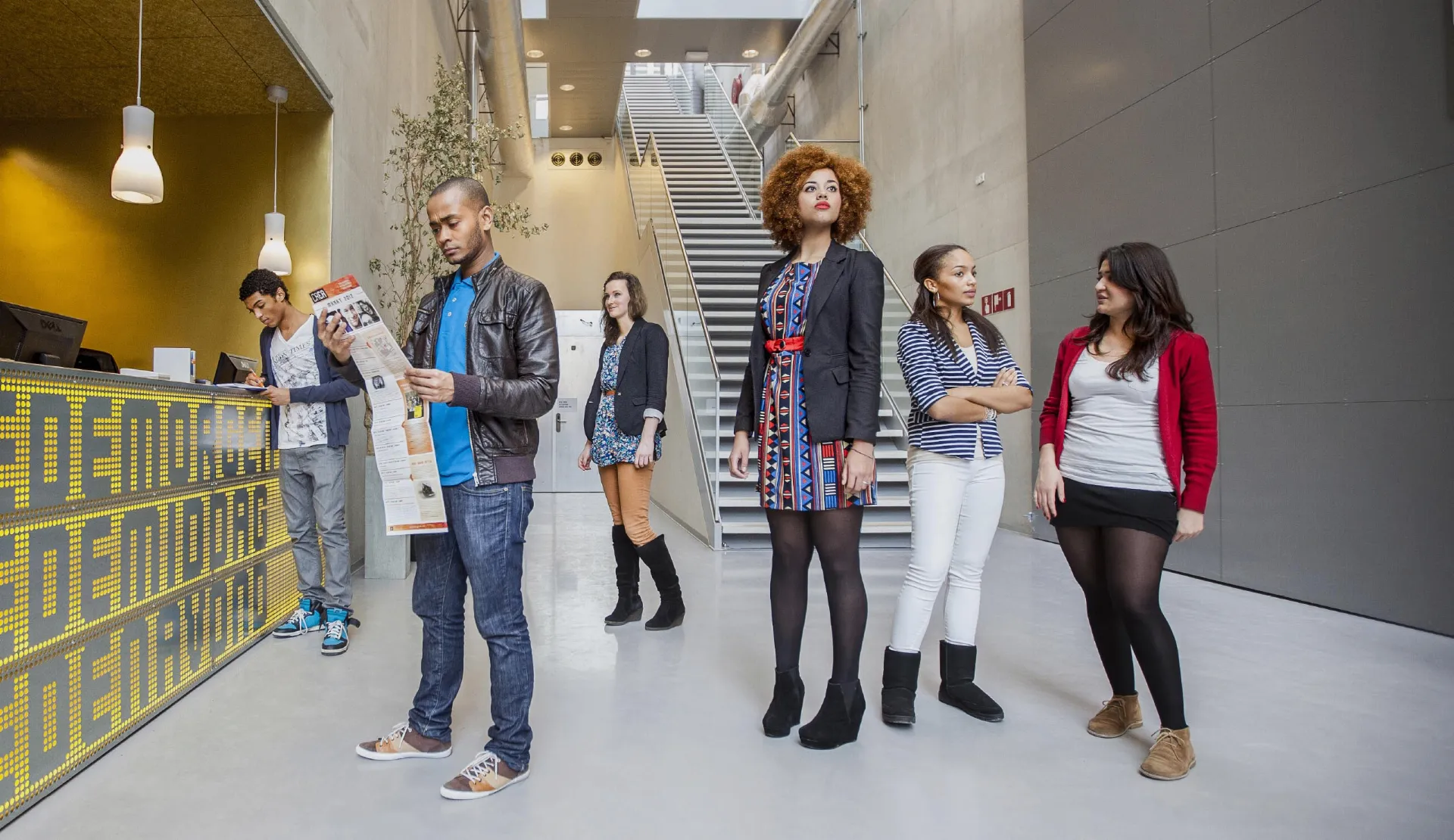 International students in the entrance hall of the UvA REC building